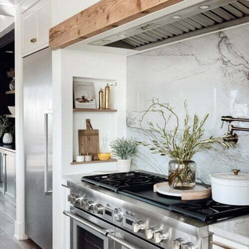 Modern kitchen with stainless steel stove.