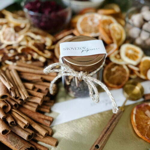 Stovetop potpourri with cinnamon sticks and oranges.