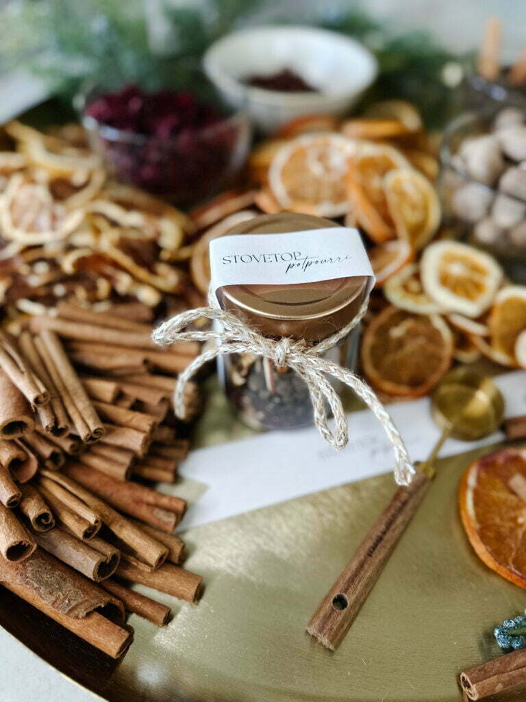 Stovetop potpourri with cinnamon sticks and oranges.