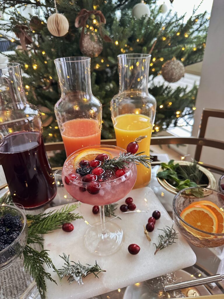 Cranberry rosemary cocktail with orange slices.