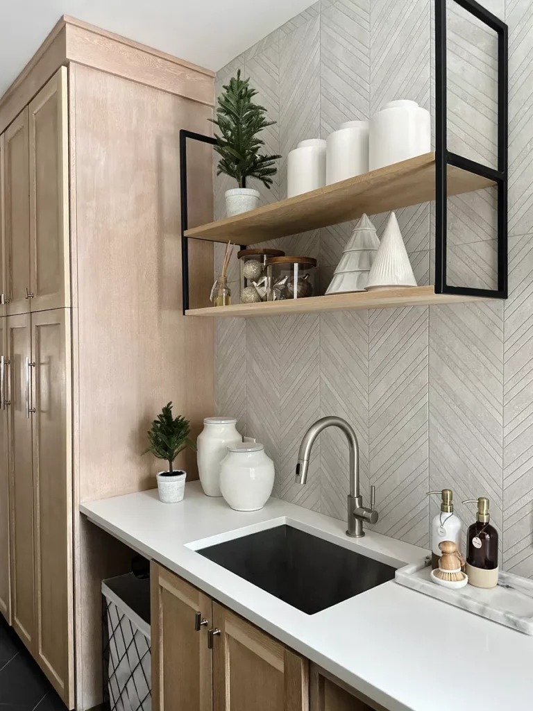 Modern kitchen sink with open shelving.