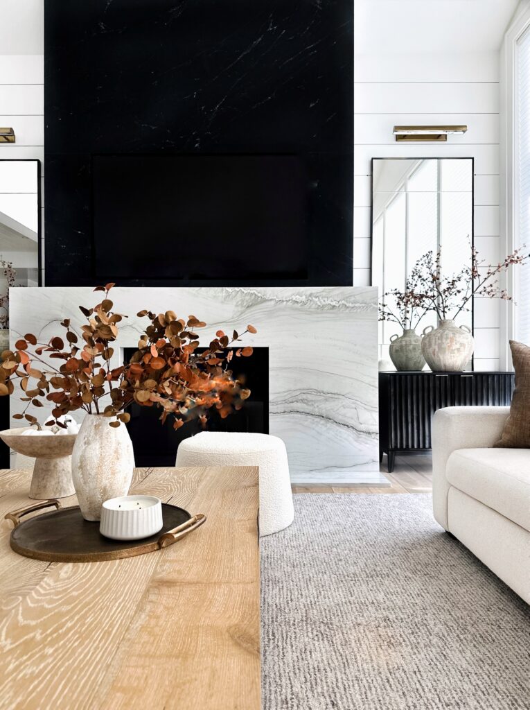 Living room with fireplace and white couch.