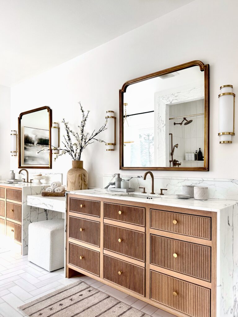 Modern bathroom vanity with gold accents.