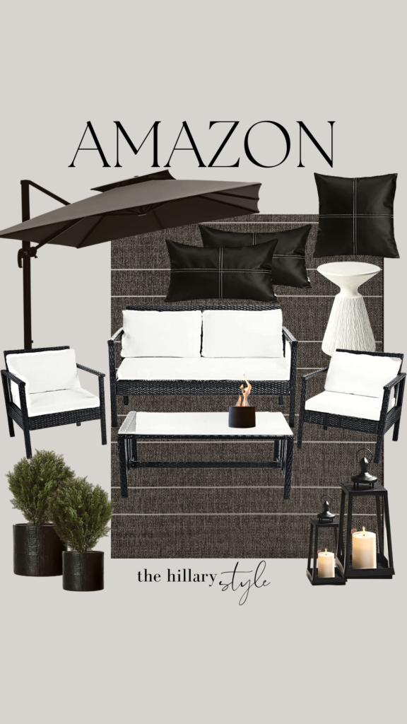 Black patio furniture with umbrella and plants.