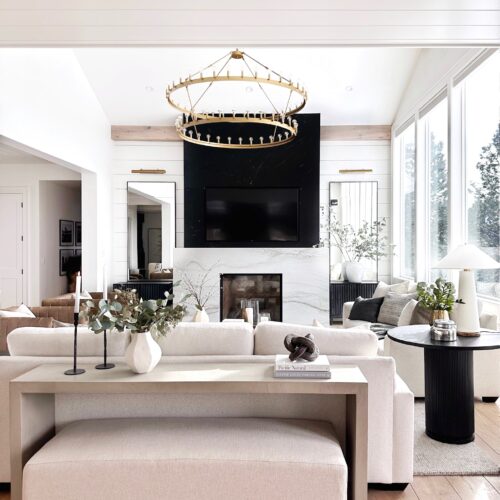 White couch and ottoman in living room.