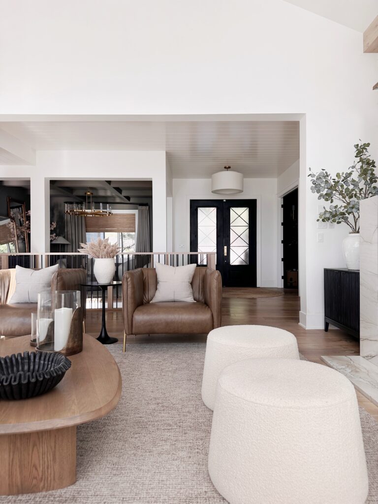 Modern living room with brown leather chair.