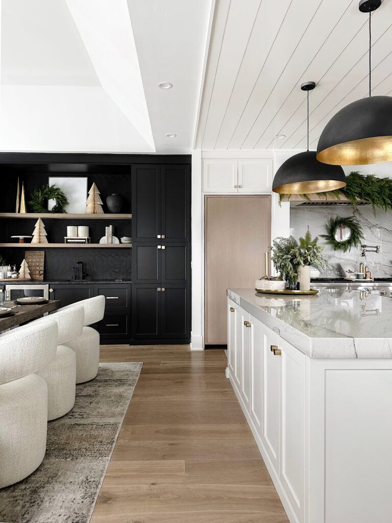 Modern kitchen with gold pendant lights.