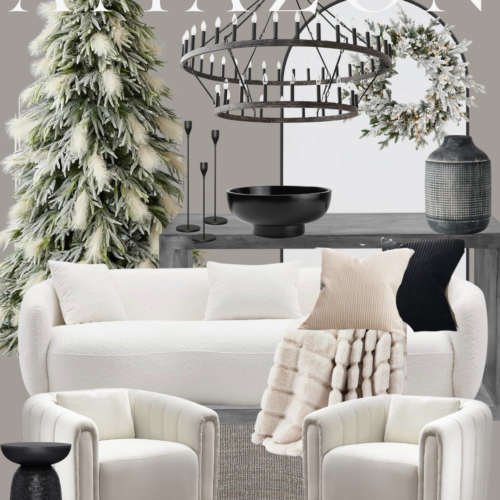 Living room with white furniture and a chandelier.