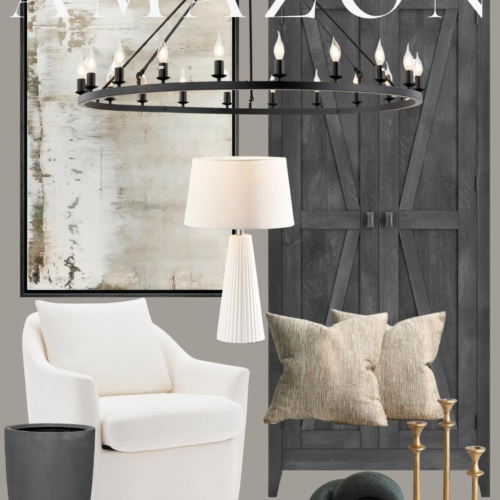 Black chandelier over white armchair and cabinet.