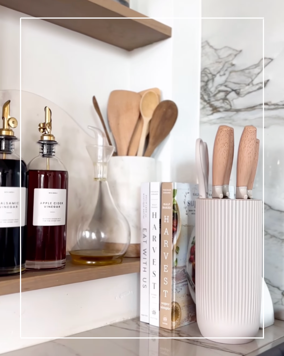 Kitchen countertop with knives in a holder.