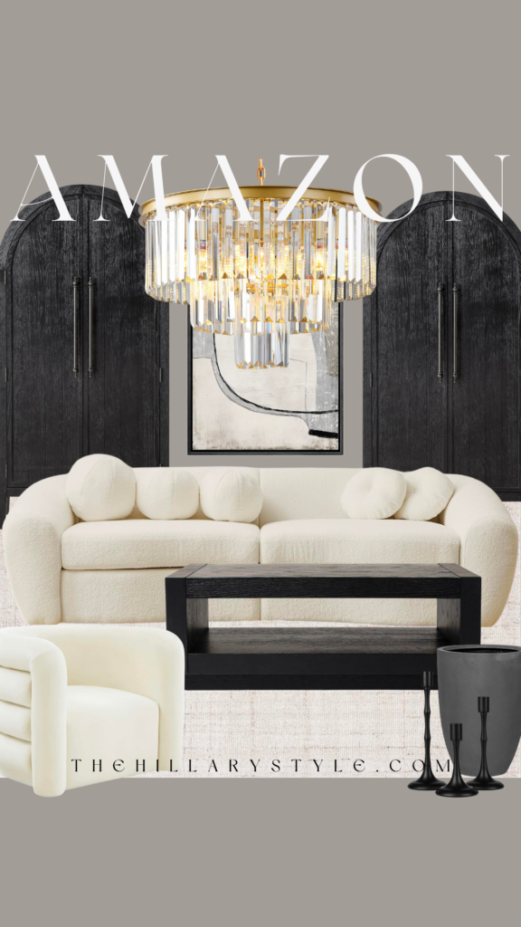 White couch and crystal chandelier in a living room.